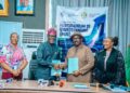 The Director-General, Nigeria Civil Aviation Authority (NCAA), Capt. Chris Najomo (right) and the Commissioner for Insurance/CEO, National Insurance Commission (NAICOM), Mr. Olusegun Ayo Omosehin, displaying the MoU both signed on Aviation Insurance at the NCAA Corporate Headquarters, Abuja, on Wednesday. With them are Mrs. Bola Odukale (Left), the Director-General and CEO, Nigerian Insurers Association (NIA), and Mrs. Mary Tufano-Eche (right), Director, Legal Services\Company Secretary. NCAA.